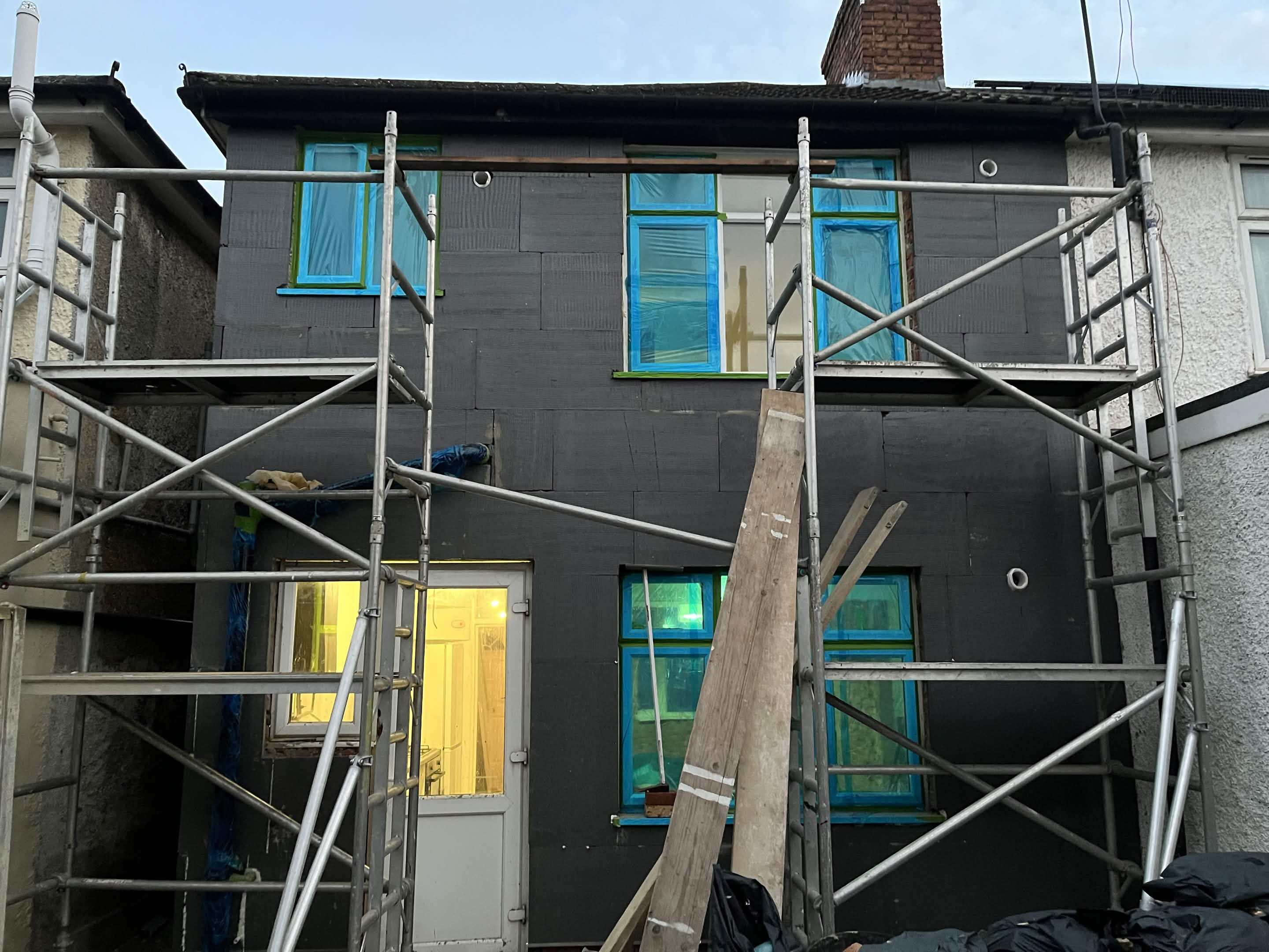 House No. 1 back elevation insulation boards and scaffolding stage