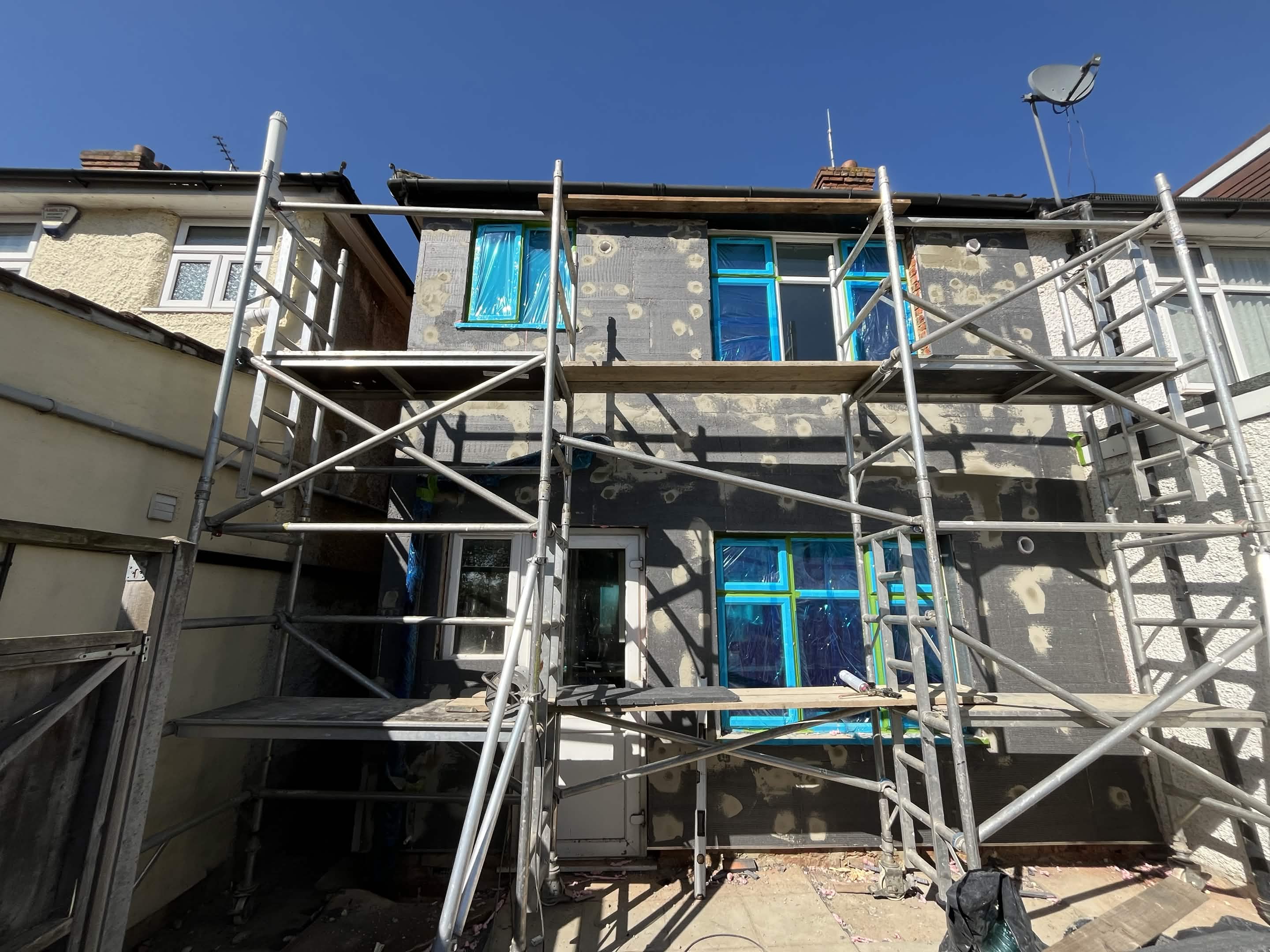 House No. 1 back elevation external wall insulation before render