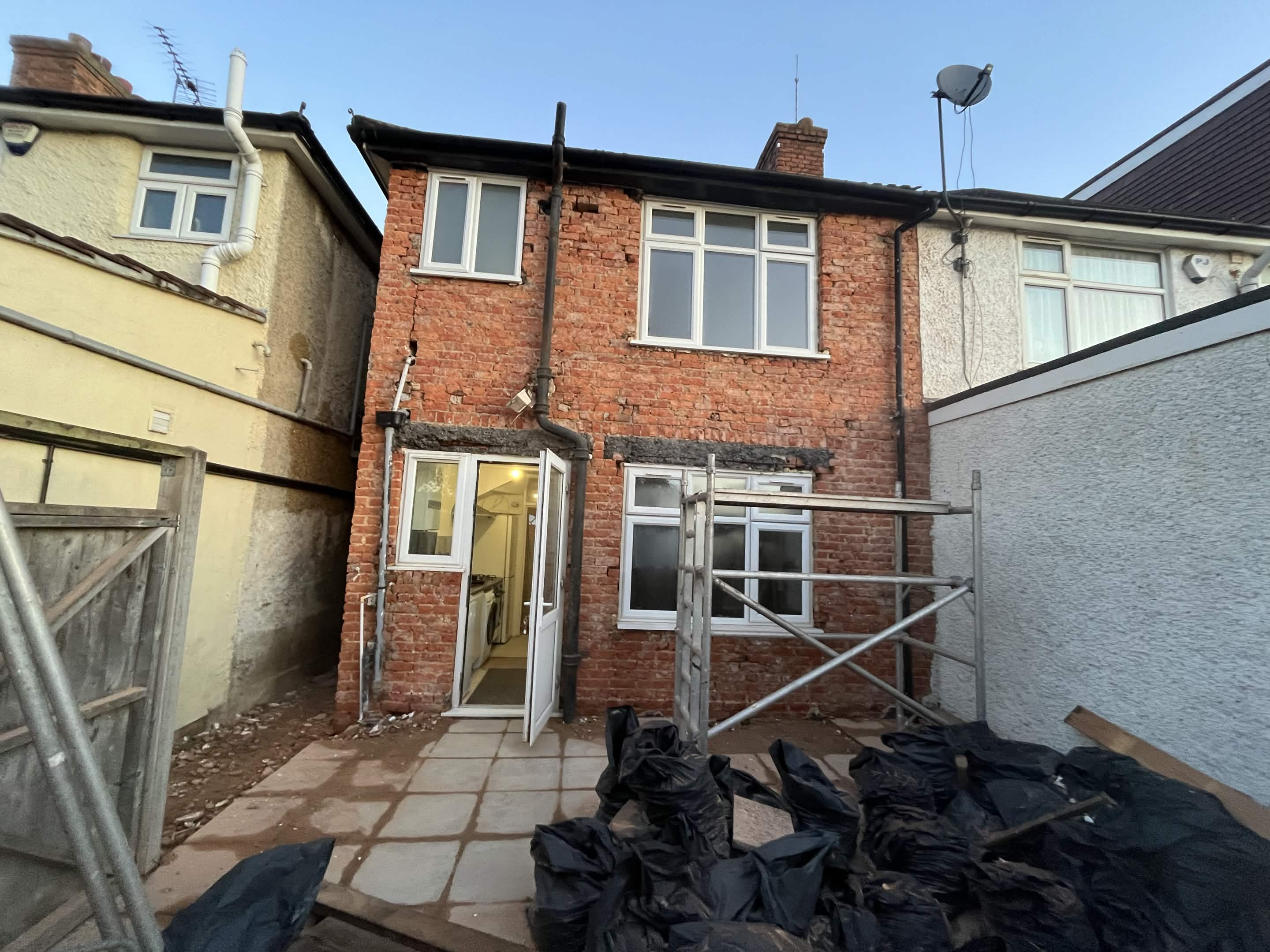 House No. 1 back elevation preparation stage before insulation